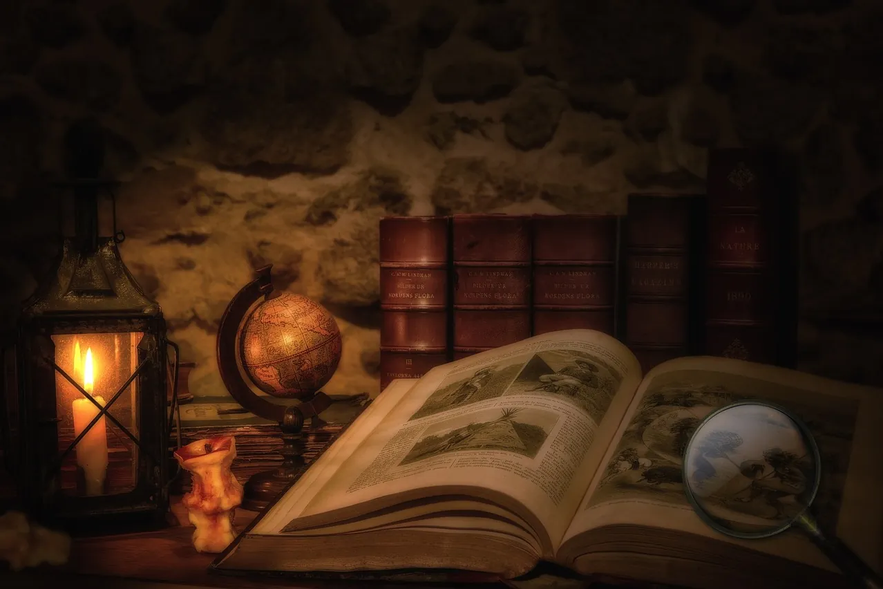 Old book, lantern, magnifying glass